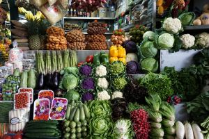 Vegetables are displayed for sale at a stand at Surquillo market in Lima, Peru.