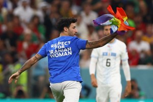 A pitch invader disrupts Portugal v. Uruguay at the Qatar World Cup