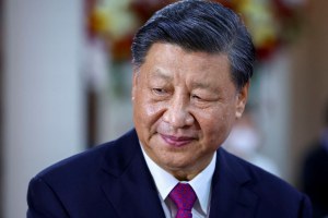 Xi Jinping seen from the shoulders up looking to his right.