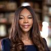Headshot of Dambisa Moyo standing in a black outfit.