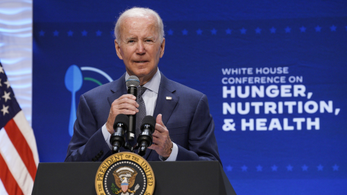 President Joe Biden speaks into a microphone at the White House Conference on Hunger, Nutrition, and Health on September 28, 2022.