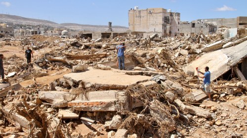 People look for survivors in Derna, Libya. Search teams are combing streets, wrecked buildings, and even the sea in Derna, where the collapse of two dams unleashed a massive flash flood that killed thousands of people.