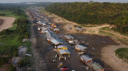 Floating homes and boats lay stranded on the dry bed of Puraquequara lake amid a severe drought sweeping across Brazil’s Amazon rainforest, which is already impacting hundreds of thousands of people and killing local wildlife.