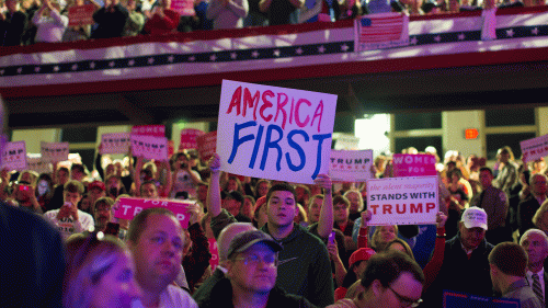 Trump supporters with a sign that reads America First