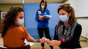 Healthcare workers take part in a rehearsal for the administration of the Pfizer coronavirus disease (COVID-19) vaccine