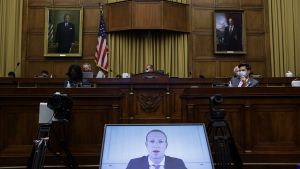 Mark Zuckerberg appears on a video feed testifying before Congress. 