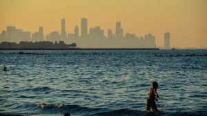 People play in the water at a public beach at Chicago's South Shore Cultural Center