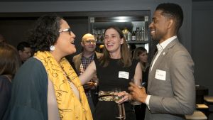 Council Emerging Leaders talk during a reception event