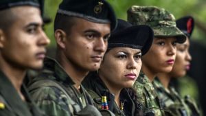 Members of the Revolutionary Armed Forces of Colombia stand during a ceremony at a camp in the Colombian mountains on Feb. 18.