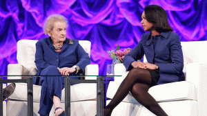 Madeleine Albright and Condoleezza Rice sitting on stage together