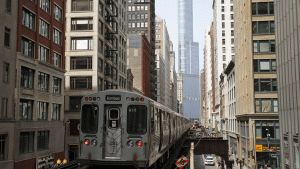 A subway car rides along the tracks towards The Trump International Hotel and Tower in downtown Chicago, Illinois.