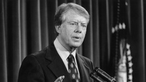 Jimmy Carter speaks at a lecturn