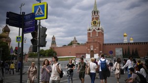 Russians walk past the Red Square