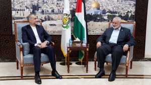 ran's Foreign Minister Hossein Amirabdollahian, left, meets with Ismail Haniyeh, one of the Palestinian militant group Hamas leaders in Doha