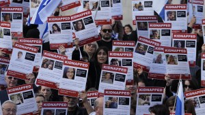 Israeli supports show placards with the faces and names of people believed to be taken hostage and held in Gaza.