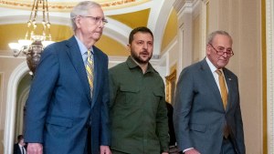 Ukrainian President Volodymyr Zelenskyy walks with Senate Minority Leader Mitch McConnell and Senate Majority Leader Chuck Schumer