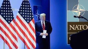 Trump on stage at a NATO summit