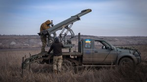 Ukrainian soldiers prepare to fire a multiple launch rocket system